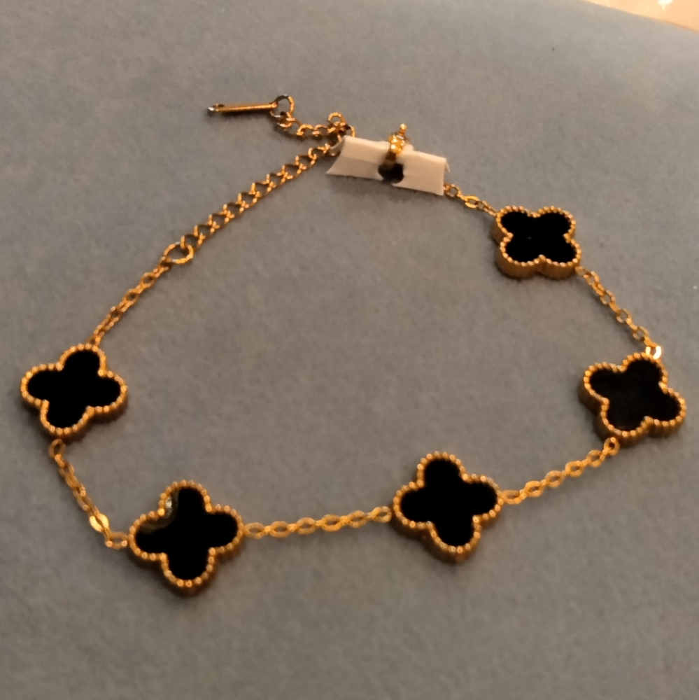 Crazy deal 4 leaf flower clover black bracelet gold plated Looks for less.